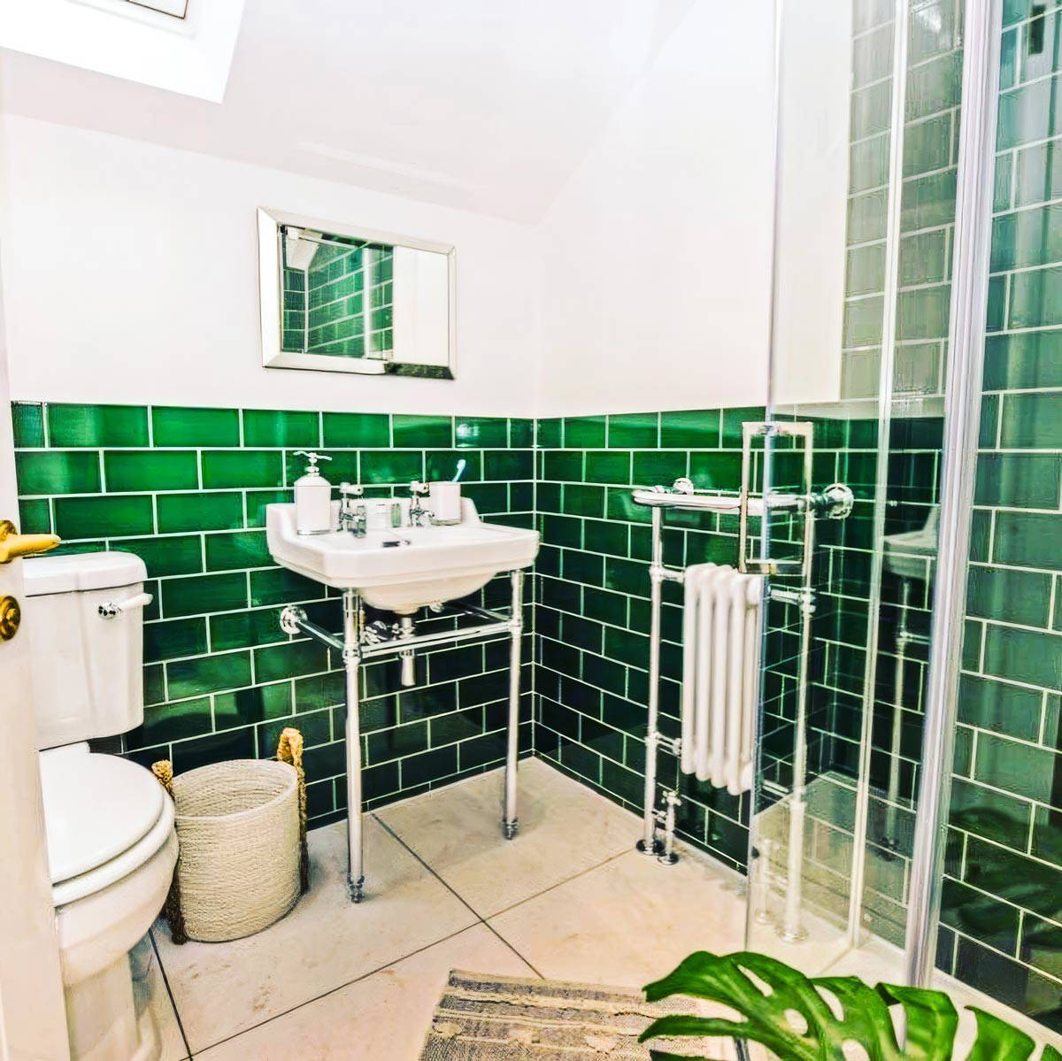 A newly completed premium master bathroom with freestanding bath, wall-mounted taps, and bespoke vanity unit.