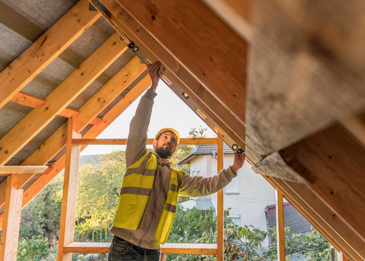 A clean, modern attic room featuring multiple flush-fitting Velux rooflight windows letting in natural light.